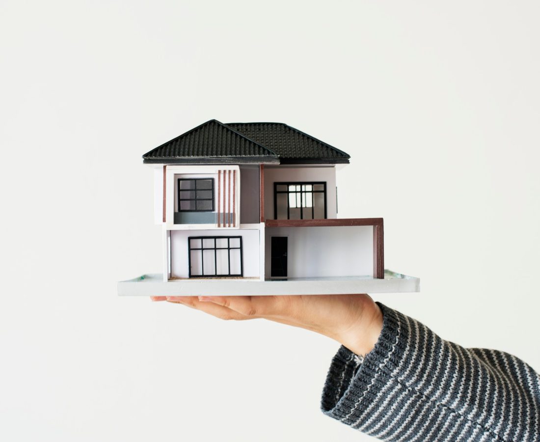 hand-presenting-model-house-home-loan-campaign